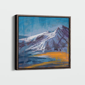 "Touching the Sky" by James Ayers displayed in a modern home, showcasing its vivid mountain colors and contemporary style in a warm, inviting space.